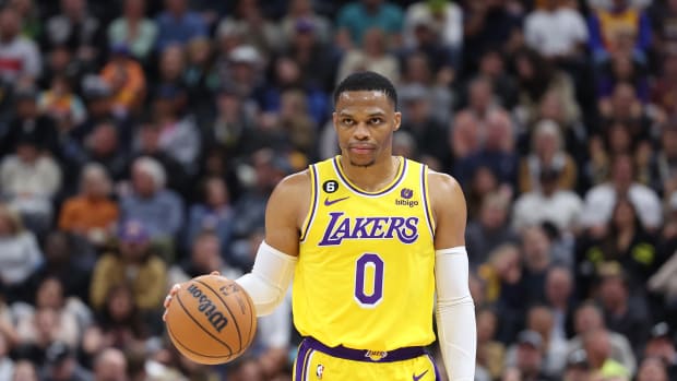 Russell Westbrook dribbles the ball.